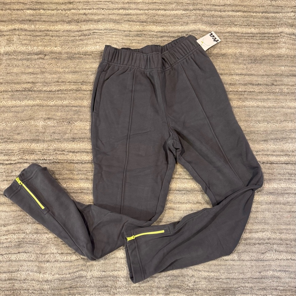 NWT. KidsTea Collection Zip Ankle Pants. Grey with neon yellow zippers. Size 12.